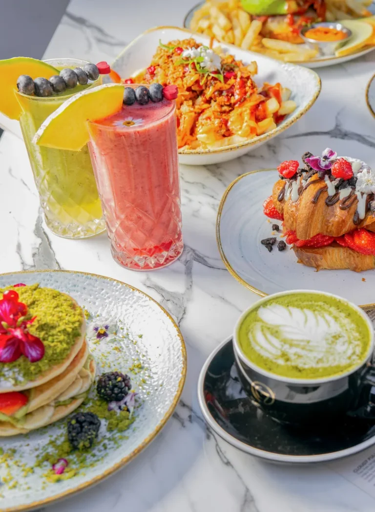 A table of halal brunch plates, pancakes and drinks at Cloud 7 Brunch London